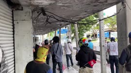 Thai protesters hurl rocks at police who respond with tear gas