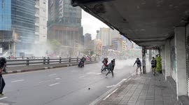 Riot police fire tear gas at protesters in Bangkok, Thailand