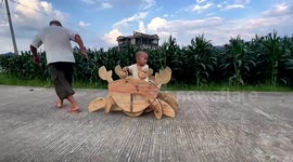 Chinese carpenter makes crab-shaped wooden car for grandson