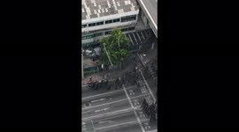 Dozens of police officers take down single protester in Bangkok
