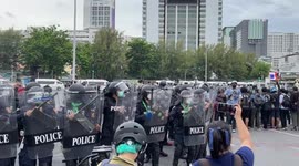 Riot police fire tear gas at activists in Bangkok, Thailand