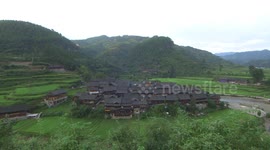 The process of weaving and spinning by two Miao elders living in a time-honored Miao village in Guizhou, China