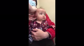 Harvey Girl Gets hearing aids/really hears for the very first time.
