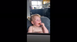 Sleepy UK baby refuses to drift off while eating snack