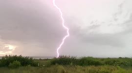 Storm chaser captures incredibly close bolt of lightning striking beach in Florida