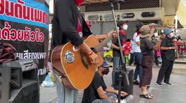 Music show and banners before Bangkok anti-government protest turns violent
