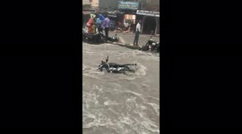 Floods wash away motorbikes after heavy rains in Varanasi, India