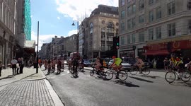 Hundreds of naked cyclists ride past Savoy Hotel in London for World Naked Bike Ride