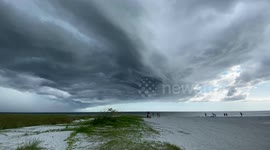 Watch stunning footage of large storm cell hovering over beach in Florida