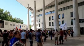 Protesters praise health care workers as they march to denounce health pass in Nantes, France