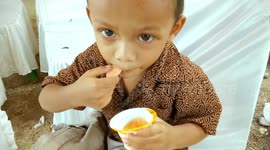 A Kid Licks Ice Cream While His Snot Coming Out He Does Not Care About It Very Funny