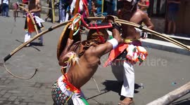 Dancers whip each other during traditional routine to celebrate Indonesia's Independence Day