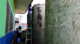 Mother cat rescued after spending five days trapped in an old water tank