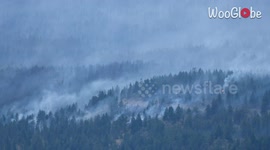 Multiple aircraft dump water on wildfire in attempt to control blaze in Canada