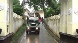 Government motorcade escorts elephant through Sri Lankan city ahead of festival