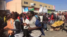 People celebrate the opposition leader Hakainde Hichilema winning election in Lusaka, Zambia