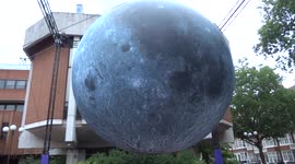 Moon descends upon Kensington Town Square with magic intergalactic art show by Luke Jerram - London