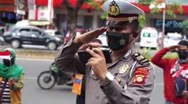 Indonesian police hold virtual Independence Day ceremony with parking attendants