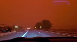 Eerie orange skies materialize in Nevada amidst California wildfire