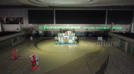 Bangkok airport in darkness as Covid-19 restrictions ground flights