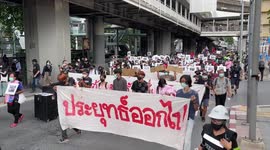Anti-government protesters march through central Bangkok before police clashes