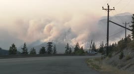 Emergency Crews and Helicopters Fighting Wildfires in British Columbia, Canada
