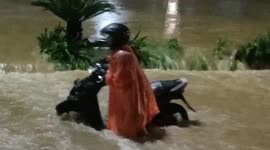 Chaos on streets of Indonesian city of Padang as severe flash floods inundate roads
