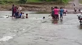 Passengers rescued from sinking vehicle washed away by river in central India
