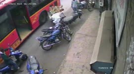 Banana street hawker in India survives shocking collision with passing bus
