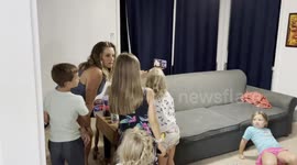 US sailor surprises children by video calling from outside their home
