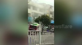 Smoke rises after bus smashes into pavement in southern China