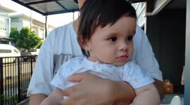 Cute baby blinking eyes when someone say one two three