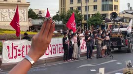 Thai anti-government activists burn pictures at Democracy Monument in Bangkok