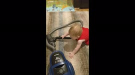 Funny baby vacuuming and making vacuum noises