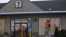 Hurricane Henri: Worker boards up 7-Eleven windows as storm approaches Long Island
