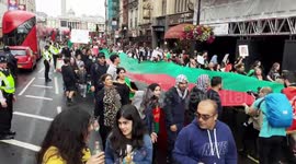 Demonstrators carry giant Afghanistan flag in London against Taliban takeover