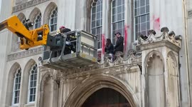Police remove Extinction Rebellion protesters who climbed facade of Guildhall in City of London
