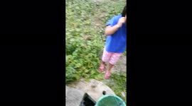 A Little Girl Sees Process Rescue A Black Snake Fall into Well