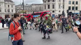 Extinction Rebellion drummers close main roundabout in Trafalgar Square