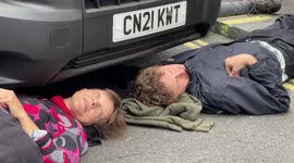 Extinction Rebellion eco-protesters chain themselves to vehicles, closing London roads