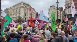 Extinction Rebellion block the streets in London’s West End with a giant table, 23 August 2021