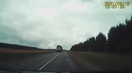 Big smash on Belarus road after giant log falls from timber lorry