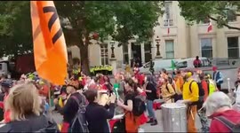 Drumming band marching down Whitehall at Extinction Rebellion protest in London, UK