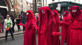 The Red Brigade arriving at the Impossible Rebellion by Extinction Rebellion Covent Garden