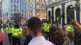 Drumming and dancing, as defiant Extinction Rebellion protestors in St Martin’s Lane, central London, refuse to go home, despite police warnings to disperse, under the Public Order Act
