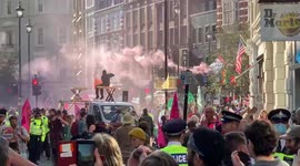 Extinction Rebellion let off pink smoke flares while blocking streets in central London
