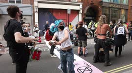 Extinction Rebellion protestors dancing on Garrick St, Covent Garden, London to petition for climate change
