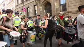 Extinction Rebellion drummers playing drums during protest on 23rd August 2021 in Covent Garden