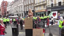 TOPLESS extinction rebellion PROTESTER WANTS RAISE AWERNESS ON CLIMATE CHANGE