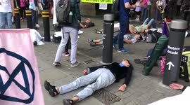 Extinction Rebellion protesters play dead outside London Bridge station